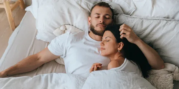 couple sleeping peacefully in bed bug free bed